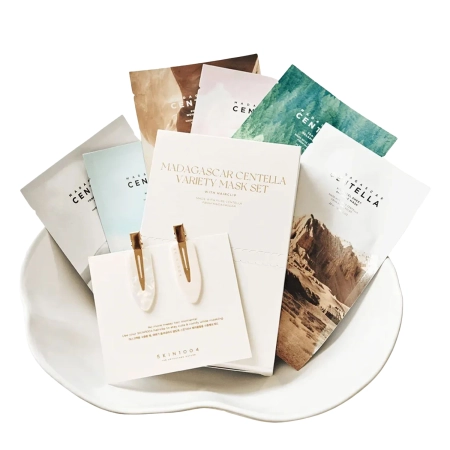 SKIN1004 - Madagascar Centella Variety Mask Set - Set mit 6 Tuchmasken und Haarklammern - 23ml + 25ml + 22ml + 23ml + 24ml + 25ml